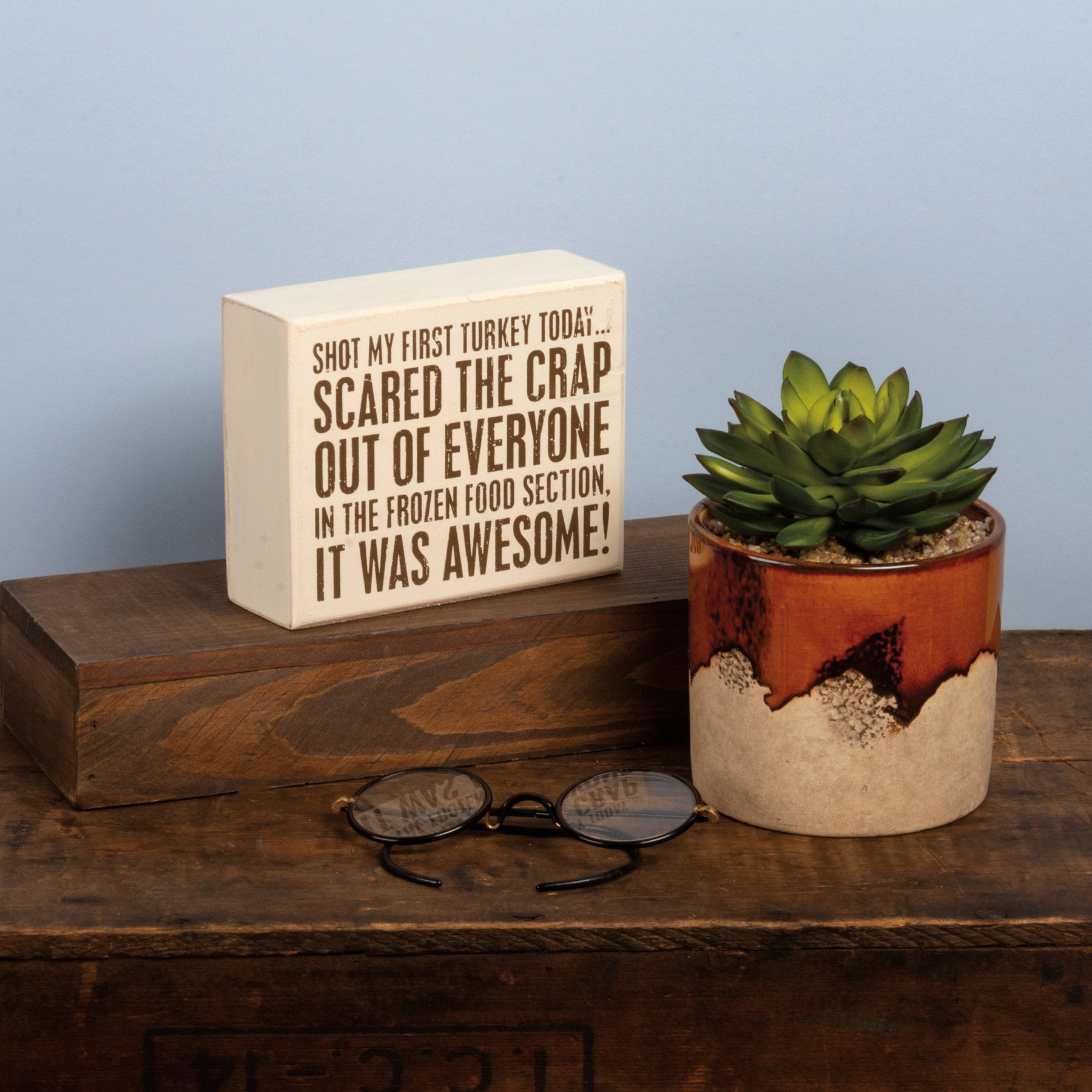 Primitives by Kathy humorous Thanksgiving wood decor sign reading "Shot My First Turkey Today" with autumn-themed design.