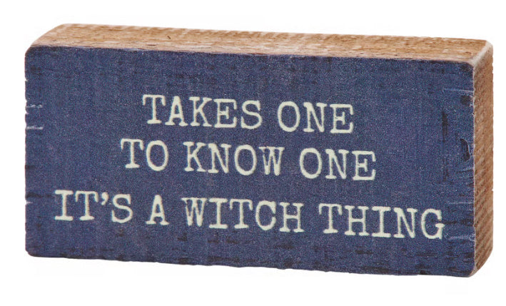 Primitives by Kathy It's A Witch Thing wood block sign with spooky Halloween decor design on a rustic surface.