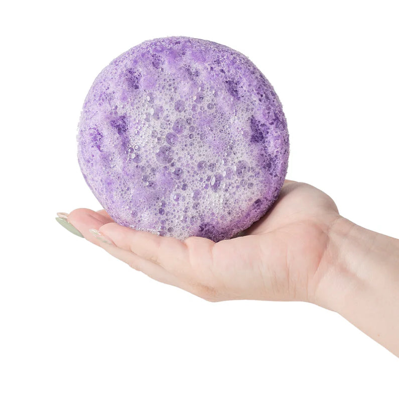 Cait and Co moisturizing bath sponge with shea, cocoa, and mango butter, showing the soft, exfoliating texture for skincare use.