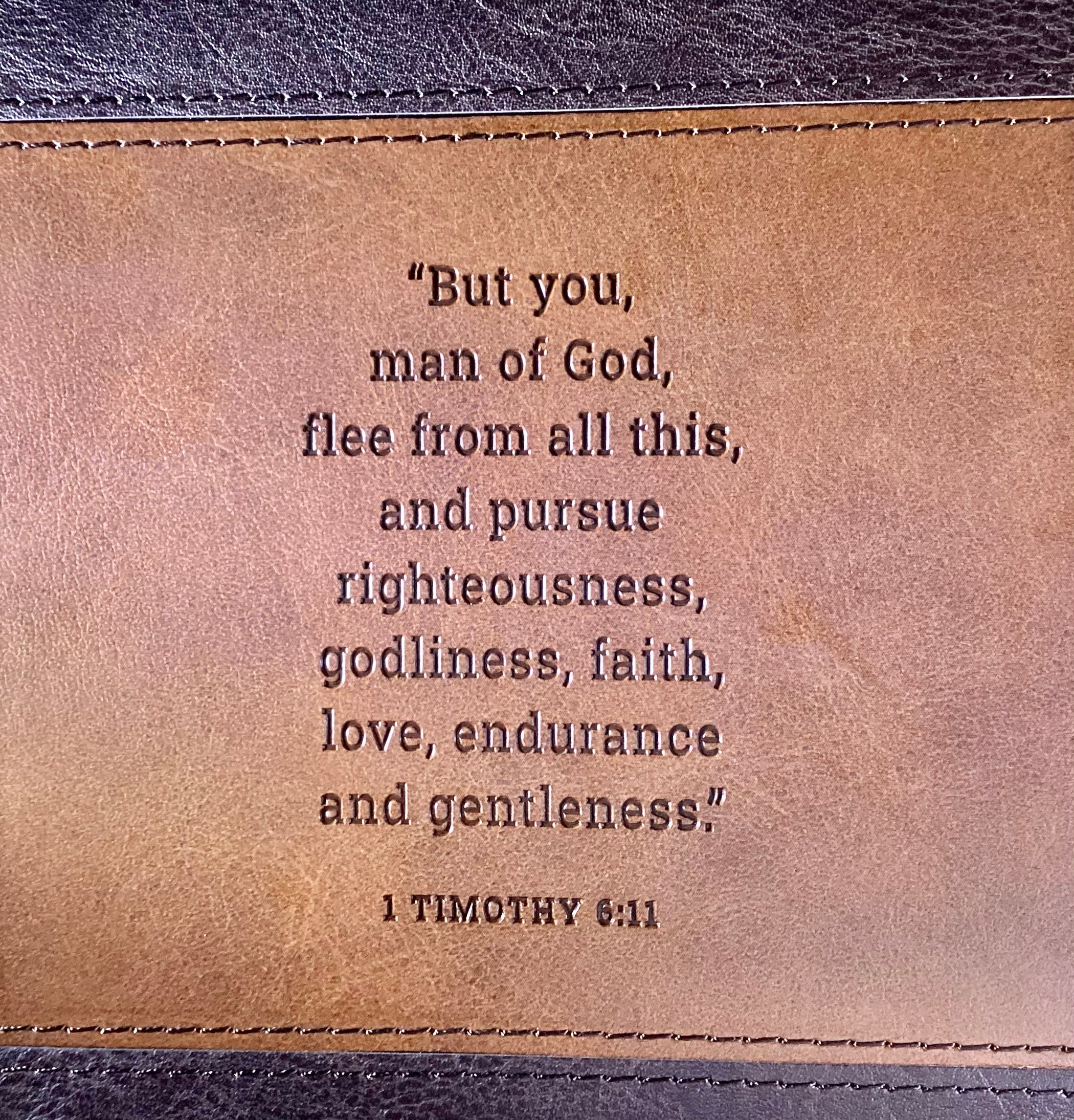 Man of God faux leather journal by Christian Art Gifts with gold accents and scripture pages, featuring a sleek, durable cover.