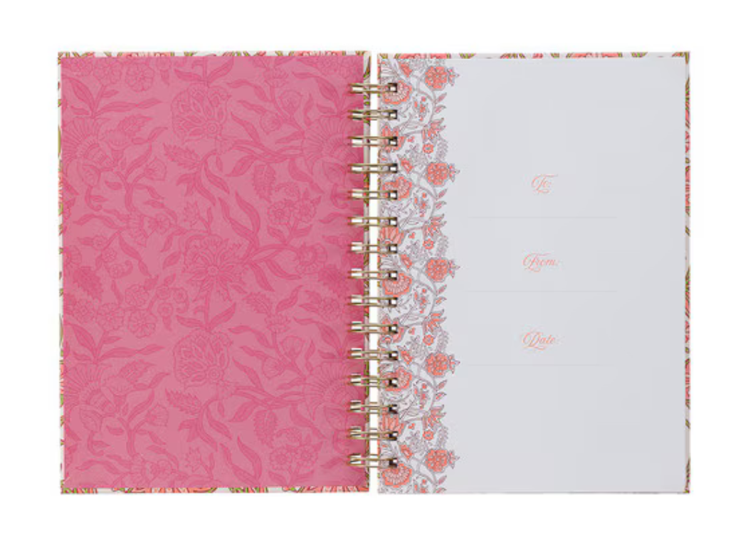 Pink floral spiral journal with gold binding titled "Be Still and Know" by Christian Art Gifts, featuring a decorative floral cover.