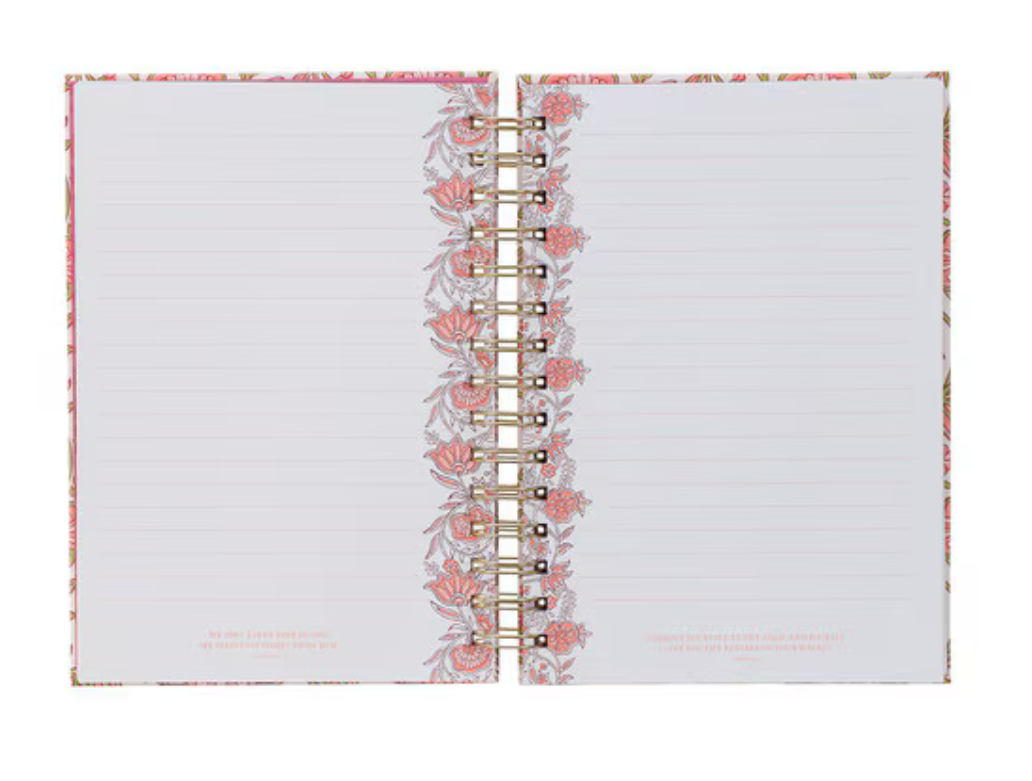 Pink floral spiral journal with gold binding titled "Be Still and Know" from Christian Art Gifts, featuring a decorative floral cover.